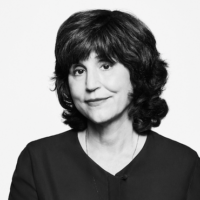 An image of journalist Kim Masters. The image is in black and white and Masters wears a black v-neck shirt and dark hair cut into a bob.